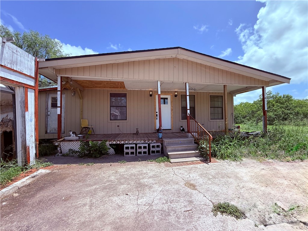 5742 Hidden Valley Loop Sandia, TX 78383 - Photo 4 of 32 a front view of a house with garden