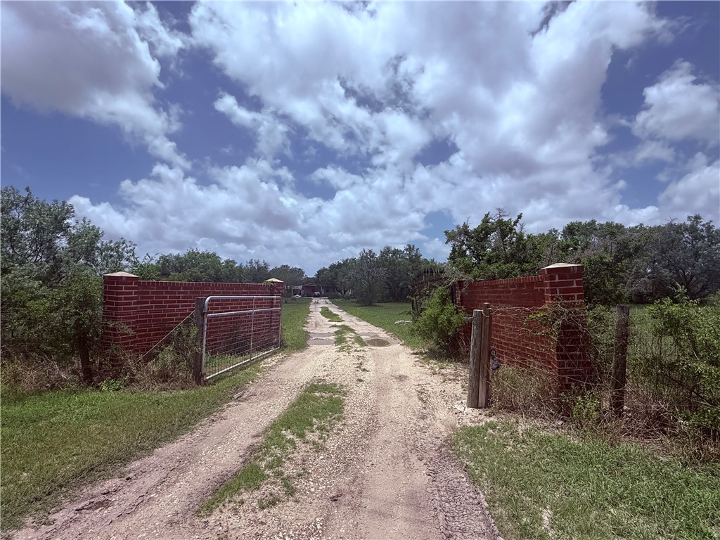 5742 Hidden Valley Loop Sandia, TX 78383 - Photo 7 of 32 a pathway of a house with a yard
