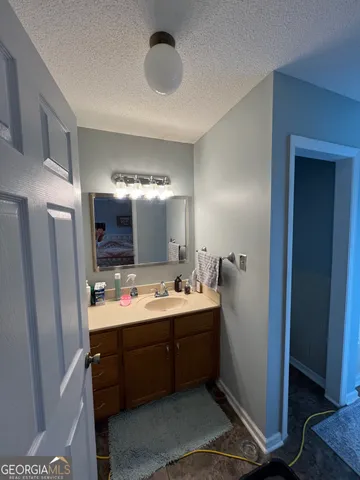 a bathroom with a double vanity sink and mirror