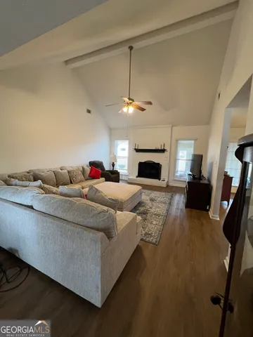 a bedroom with furniture and a chandelier