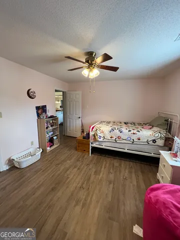 a bathroom with a sink vanity mirror and toilet