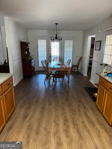a view of a dining room with furniture and window