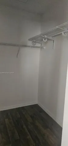 a view of a room with shelf on the wall