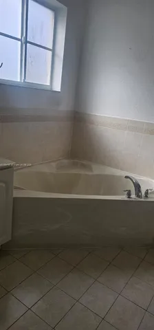 a view of a room that has a window