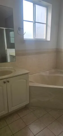a bathroom with a sink and a vanity