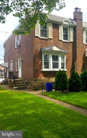 a house that has a big yard in front of it