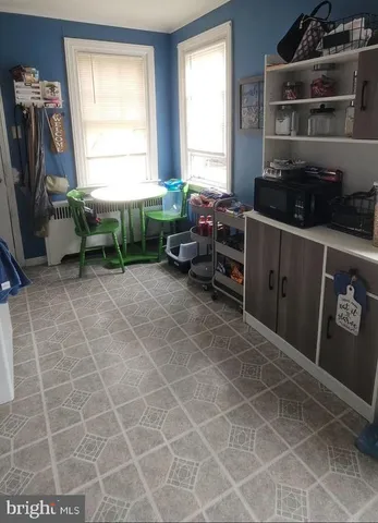 a kitchen with a sink a window and a glass door