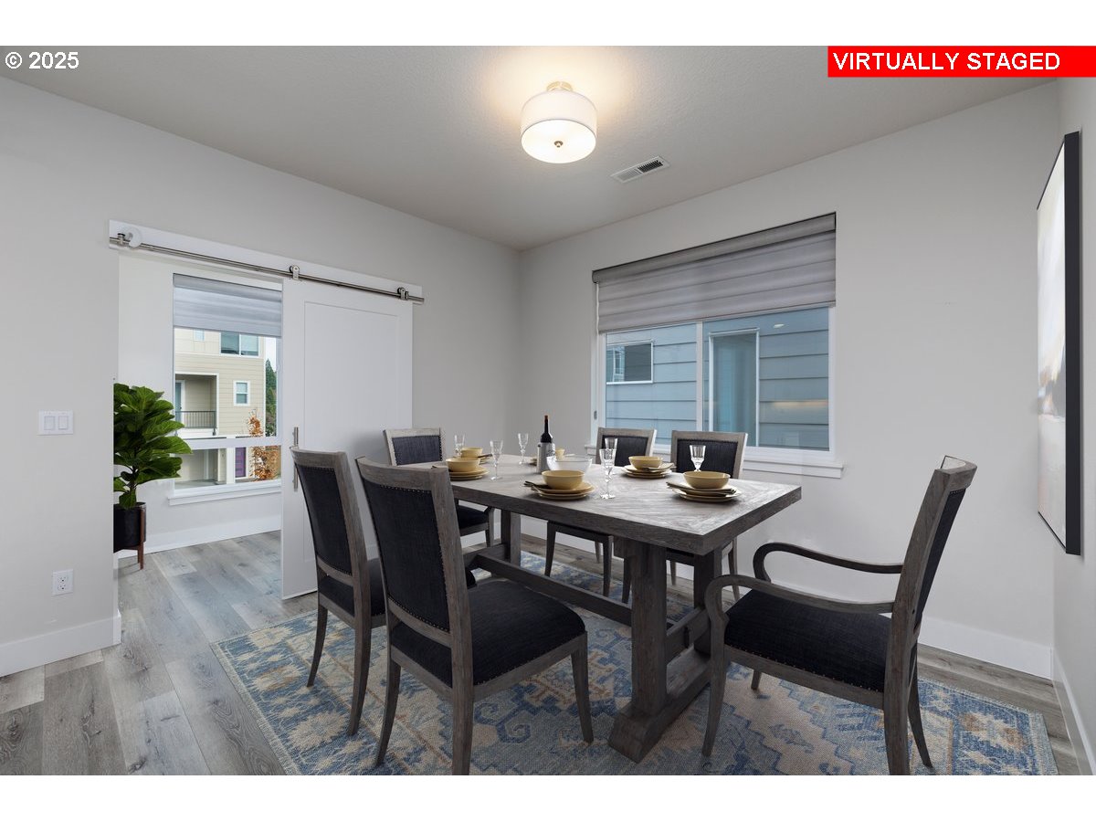 961 Southwest Stellar Terrace Beaverton, OR 97005 - Photo 13 of 25 a view of a dining room with furniture and wooden floor