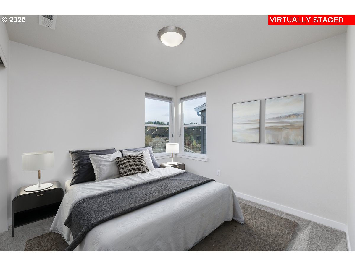 961 Southwest Stellar Terrace Beaverton, OR 97005 - Photo 19 of 25 a bedroom with a bed and window