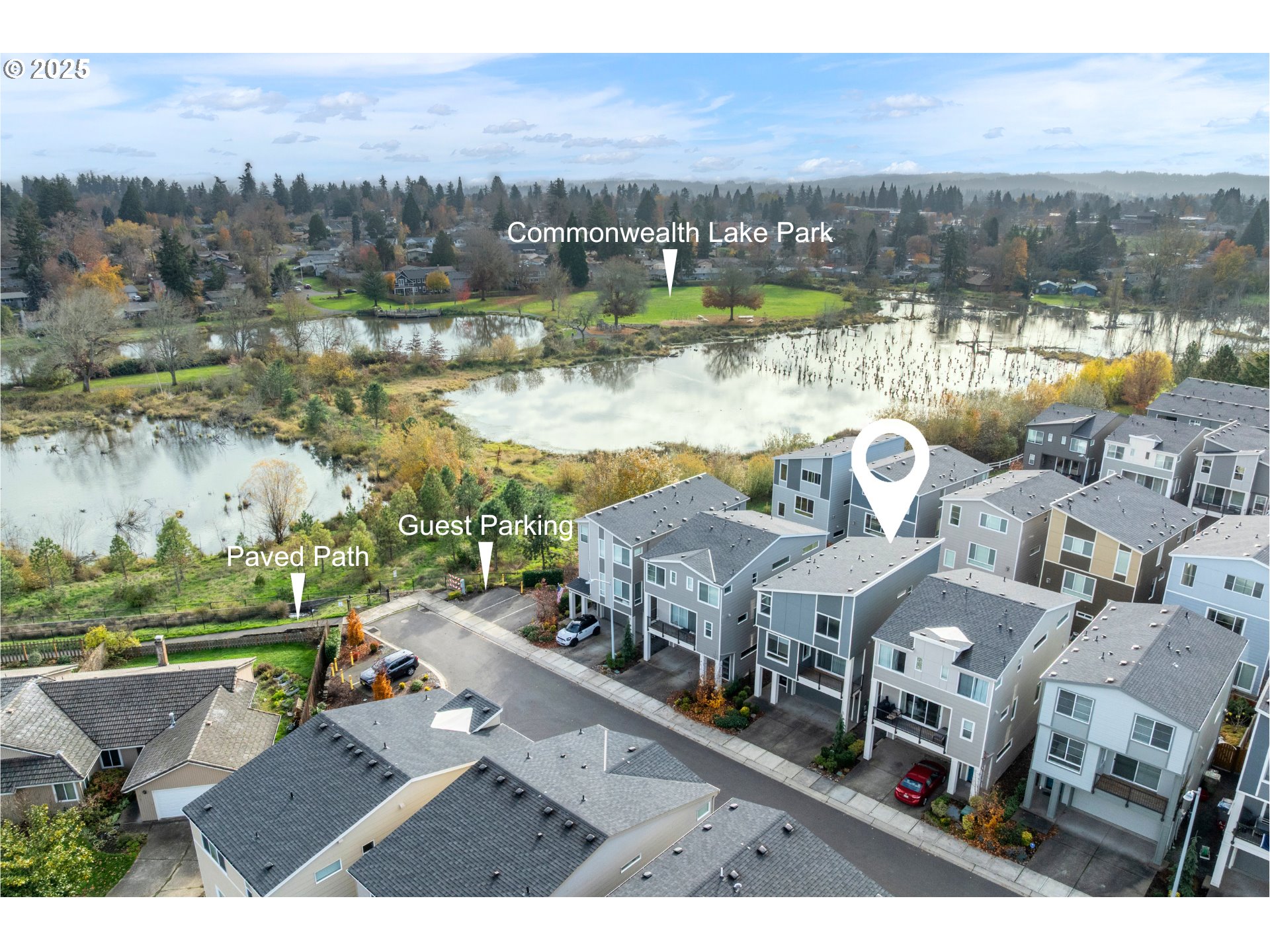 961 Southwest Stellar Terrace Beaverton, OR 97005 - Photo 3 of 25 a view of a lake with a mountain in the background