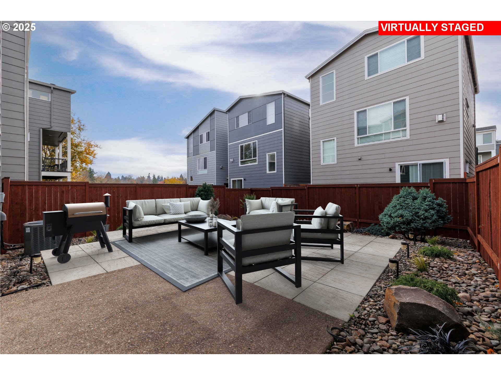 961 Southwest Stellar Terrace Beaverton, OR 97005 - Photo 5 of 25 a outdoor living space with furniture and a fireplace