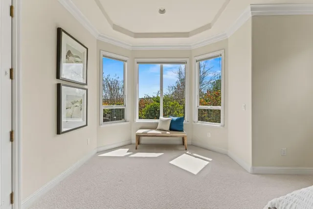 a spacious bedroom with a bed and a window