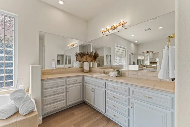 a bathroom with a shower and a bath tub