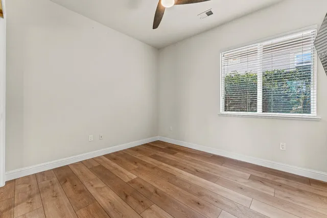 a front view of a house with porch garden and outdoor seating