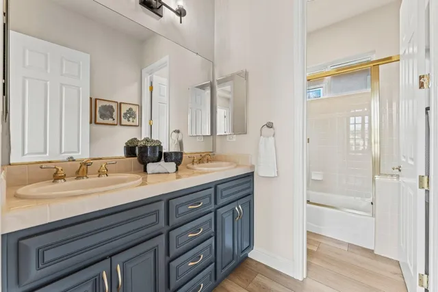 a view of a workspace with furniture and wooden floor