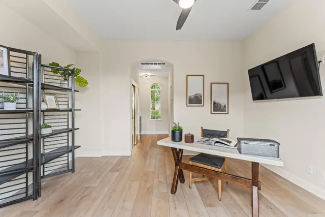 a view of a patio with couches and potted plants