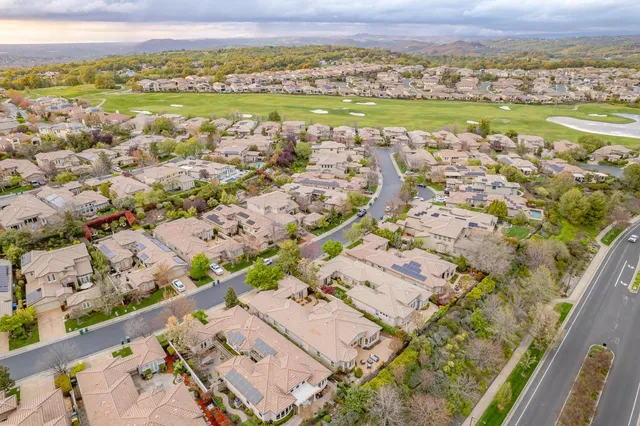 a view of a swimming pool with a yard