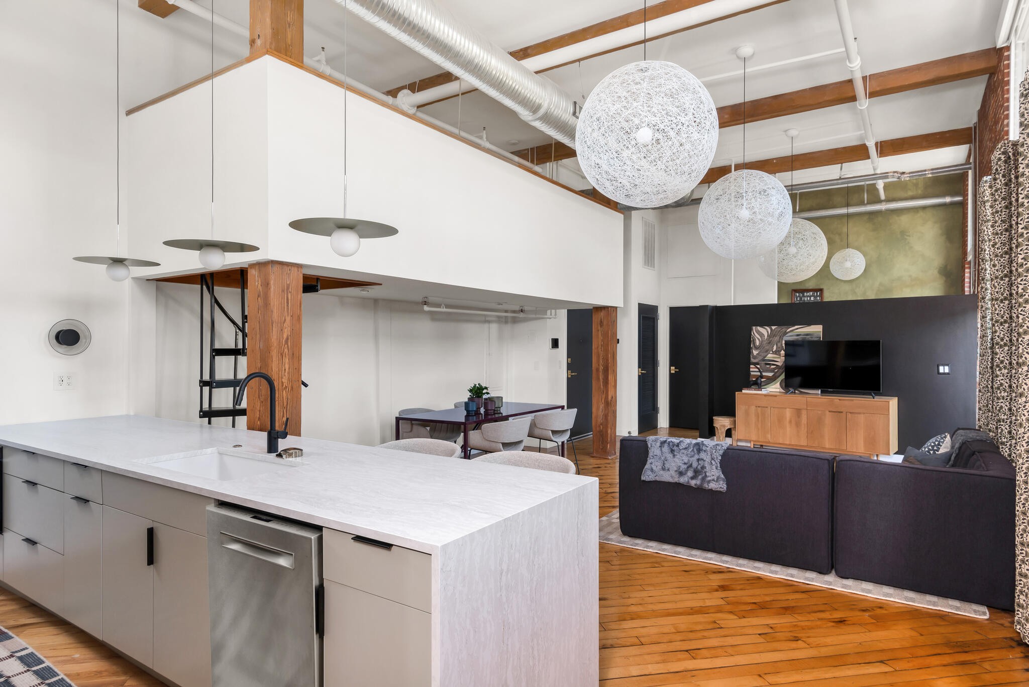 1400 Rosa L Parks Boulevard, Unit 216 Nashville, TN 37208 - Photo 11 of 29 a kitchen with stainless steel appliances a sink and a chandelier