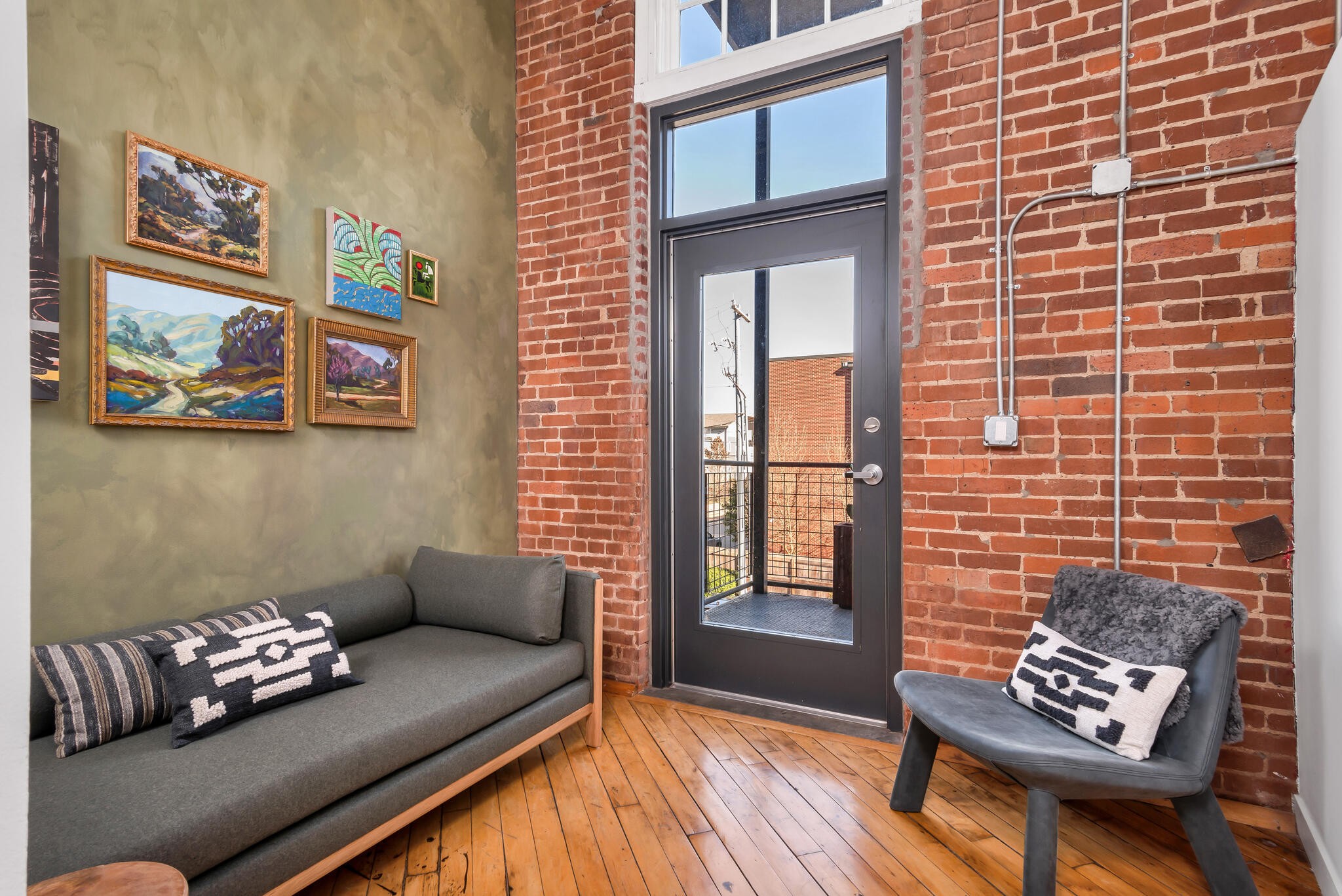 1400 Rosa L Parks Boulevard, Unit 216 Nashville, TN 37208 - Photo 12 of 29 a living room with furniture and wooden floor