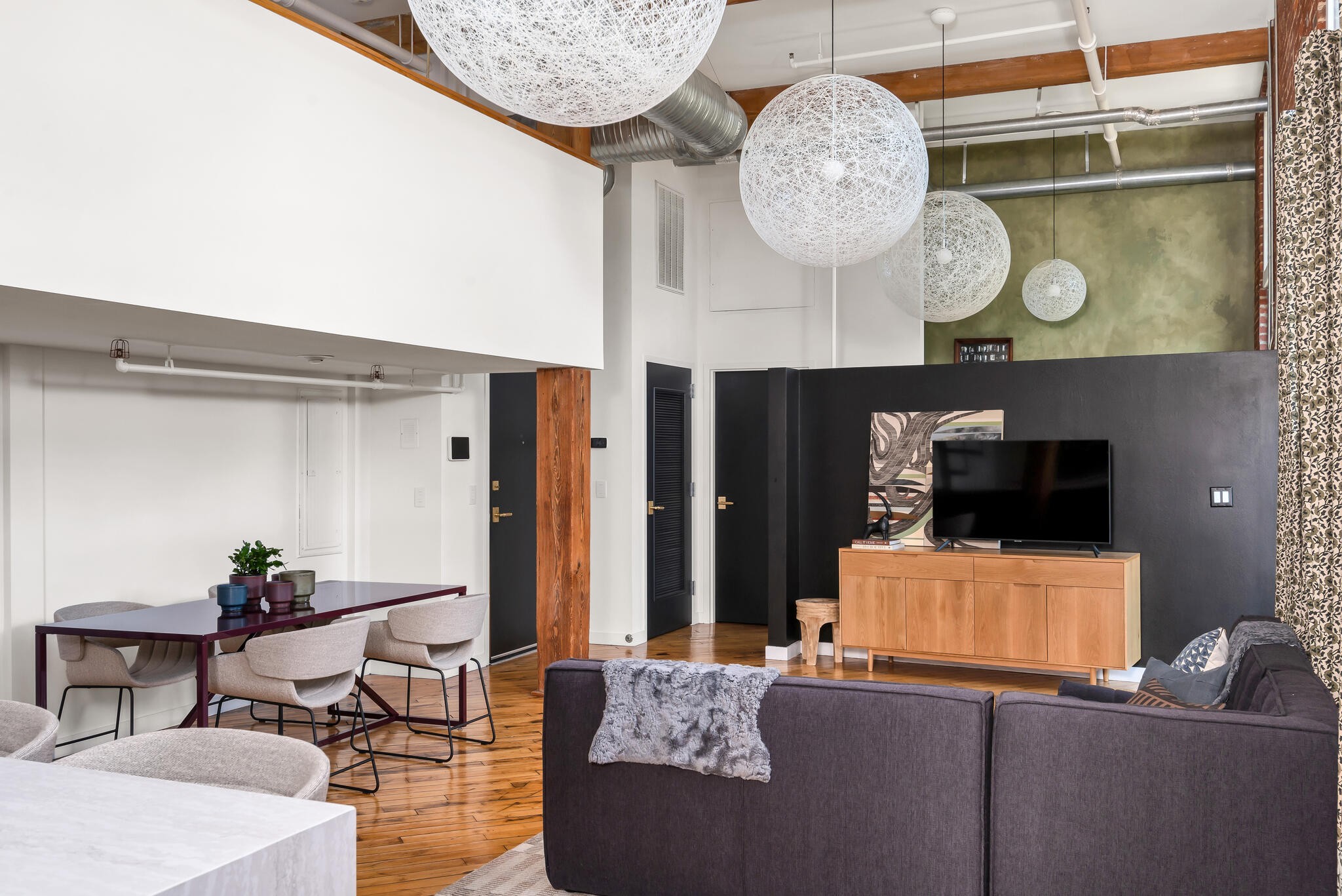 1400 Rosa L Parks Boulevard, Unit 216 Nashville, TN 37208 - Photo 18 of 29 a living room with furniture and a flat screen tv