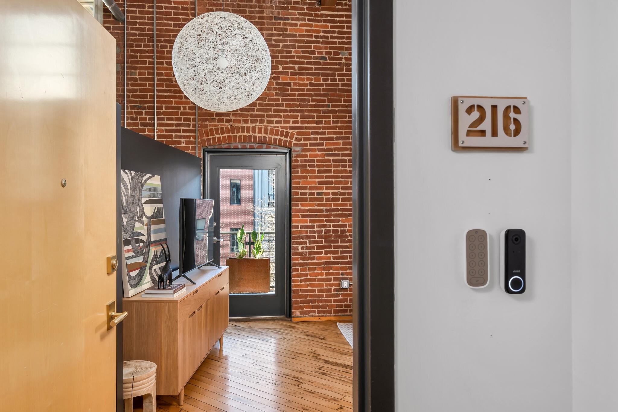 1400 Rosa L Parks Boulevard, Unit 216 Nashville, TN 37208 - Photo 2 of 29 a view of a livingroom with furniture and wooden floor