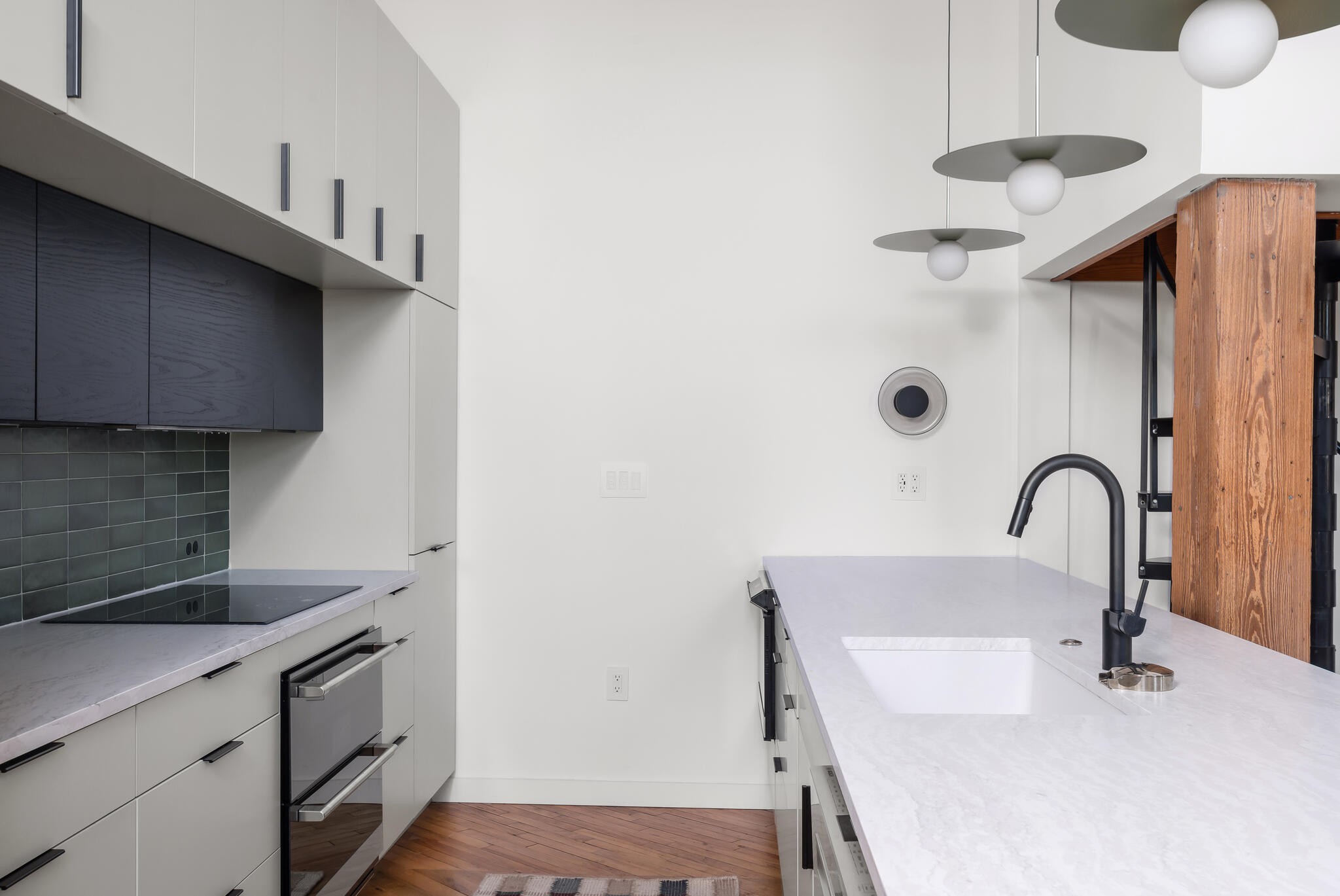 1400 Rosa L Parks Boulevard, Unit 216 Nashville, TN 37208 - Photo 6 of 29 a kitchen with a sink a counter and appliances
