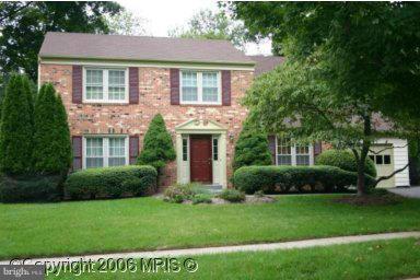 12 Starlight Court Potomac, MD 20854 - Photo 1 of 19 a front view of a house with a yard and potted plants