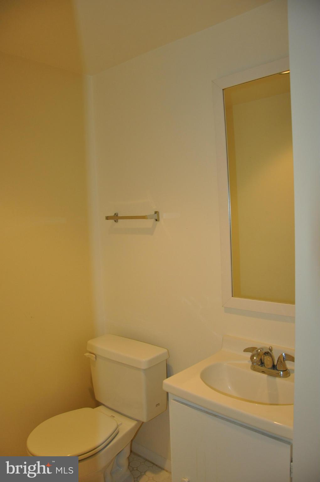 12 Starlight Court Potomac, MD 20854 - Photo 18 of 19 a white toilet sitting next to a bathroom sink