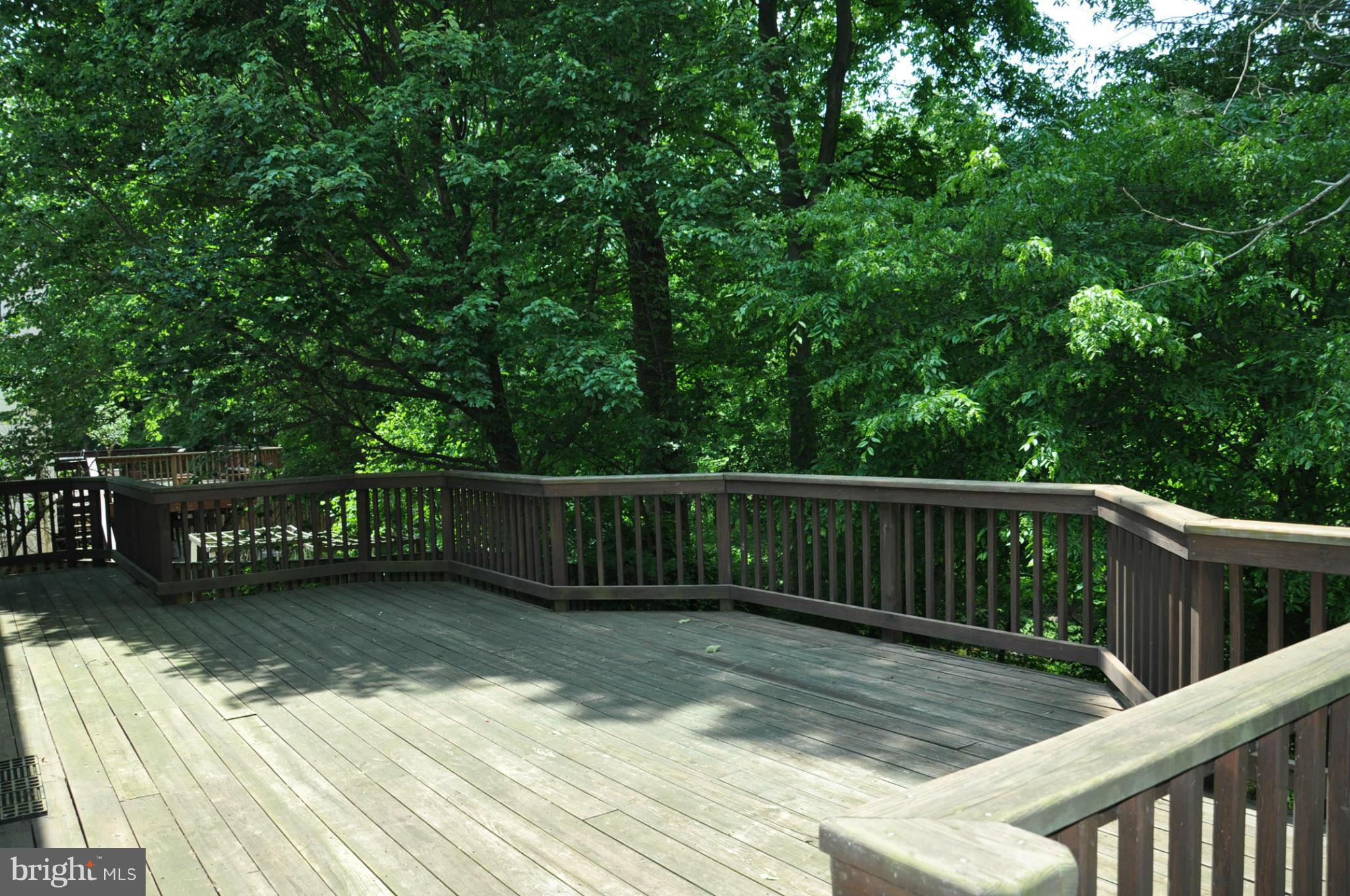 12 Starlight Court Potomac, MD 20854 - Photo 3 of 19 a view of balcony with wooden floor and fence