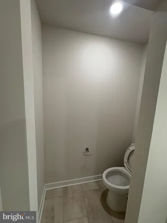 a bathroom with a toilet and a sink