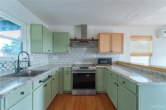 a kitchen with a sink and cabinets