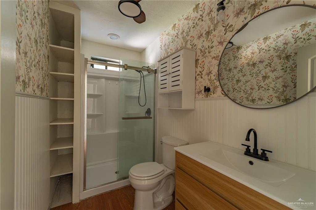 15002 Davis Road Edcouch, TX 78538 - Photo 17 of 33 a bathroom with a toilet and a sink
