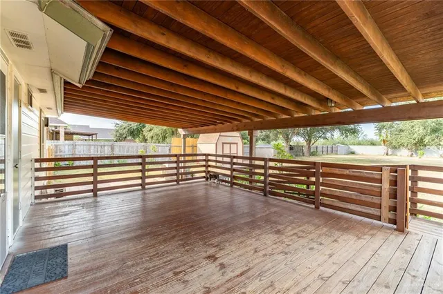 a view of outdoor space with wooden floor and barbeque oven