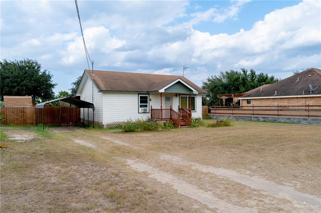 15002 Davis Road Edcouch, TX 78538 - Photo 5 of 33 a front view of a house with a garden