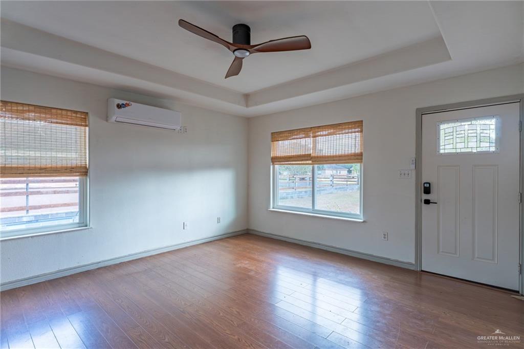 15002 Davis Road Edcouch, TX 78538 - Photo 9 of 33 a view of an empty room with wooden floor and a window