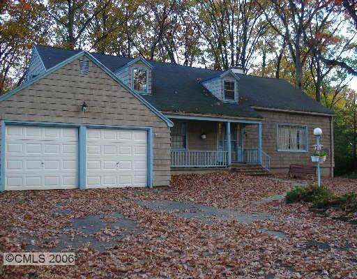 53 Harwich Road Fairfield, CT 06825 - Photo 1 of 1 a front view of a house with a garden