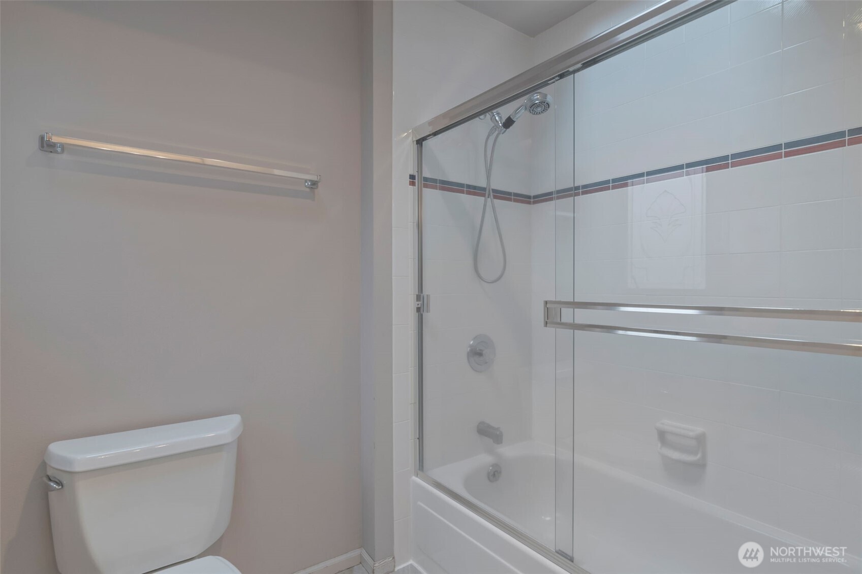 4131 205th Avenue Southeast Sammamish, WA 98075 - Photo 13 of 20 a bathroom with a shower and a toilet