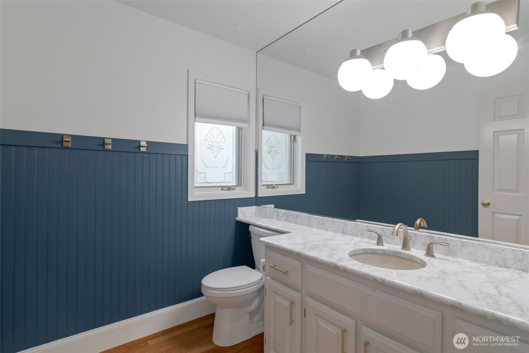 4131 205th Avenue Southeast Sammamish, WA 98075 - Photo 14 of 20 a bathroom with a granite countertop sink mirror and toilet