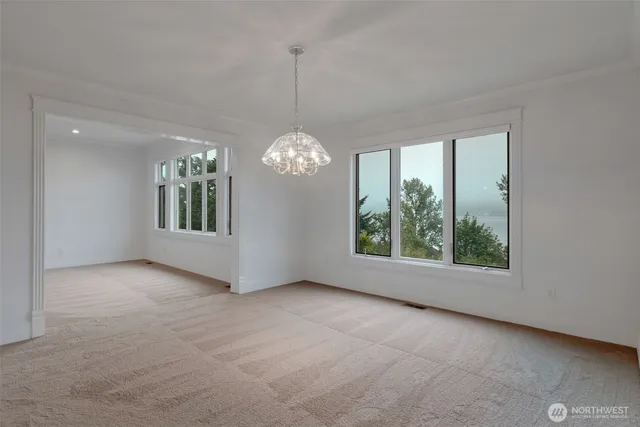 an empty room with windows and outdoor view