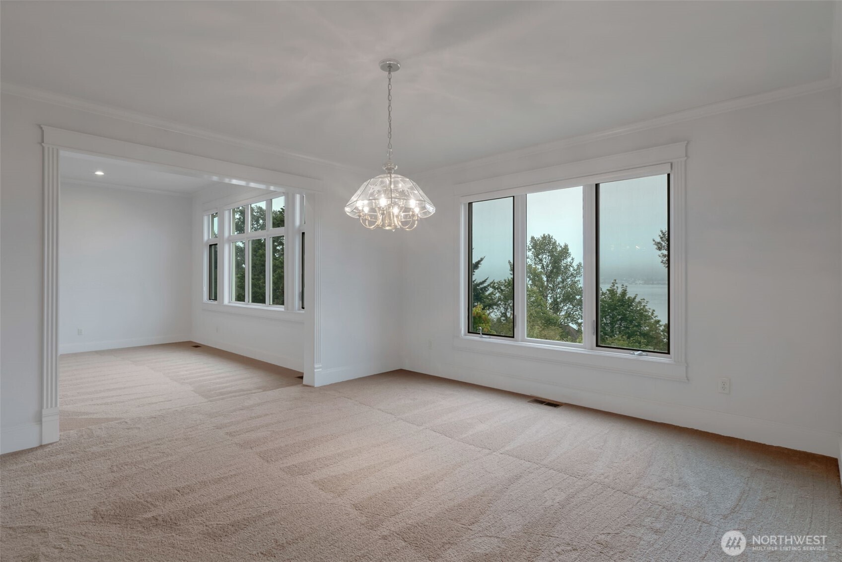 4131 205th Avenue Southeast Sammamish, WA 98075 - Photo 6 of 20 an empty room with windows and outdoor view