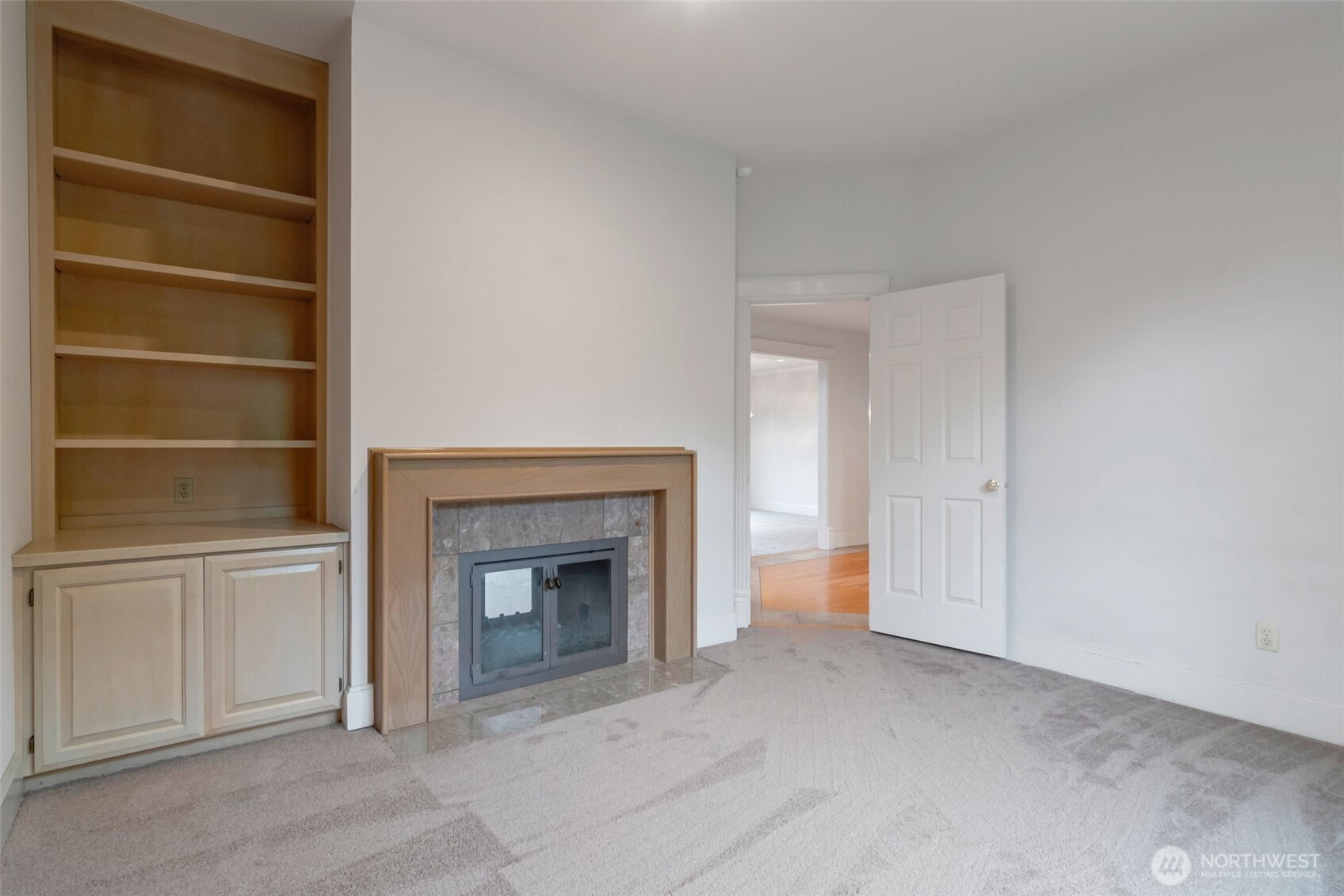 4131 205th Avenue Southeast Sammamish, WA 98075 - Photo 8 of 20 a view of empty room with a fireplace
