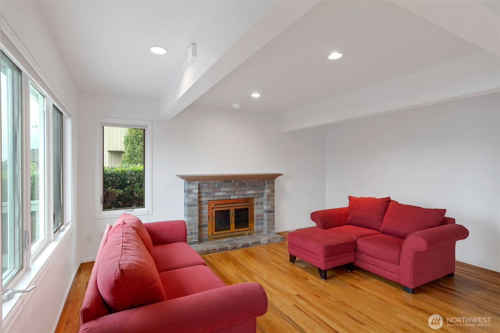 4131 205th Avenue Southeast Sammamish, WA 98075 - Photo 9 of 20 a living room with furniture fireplace and a window