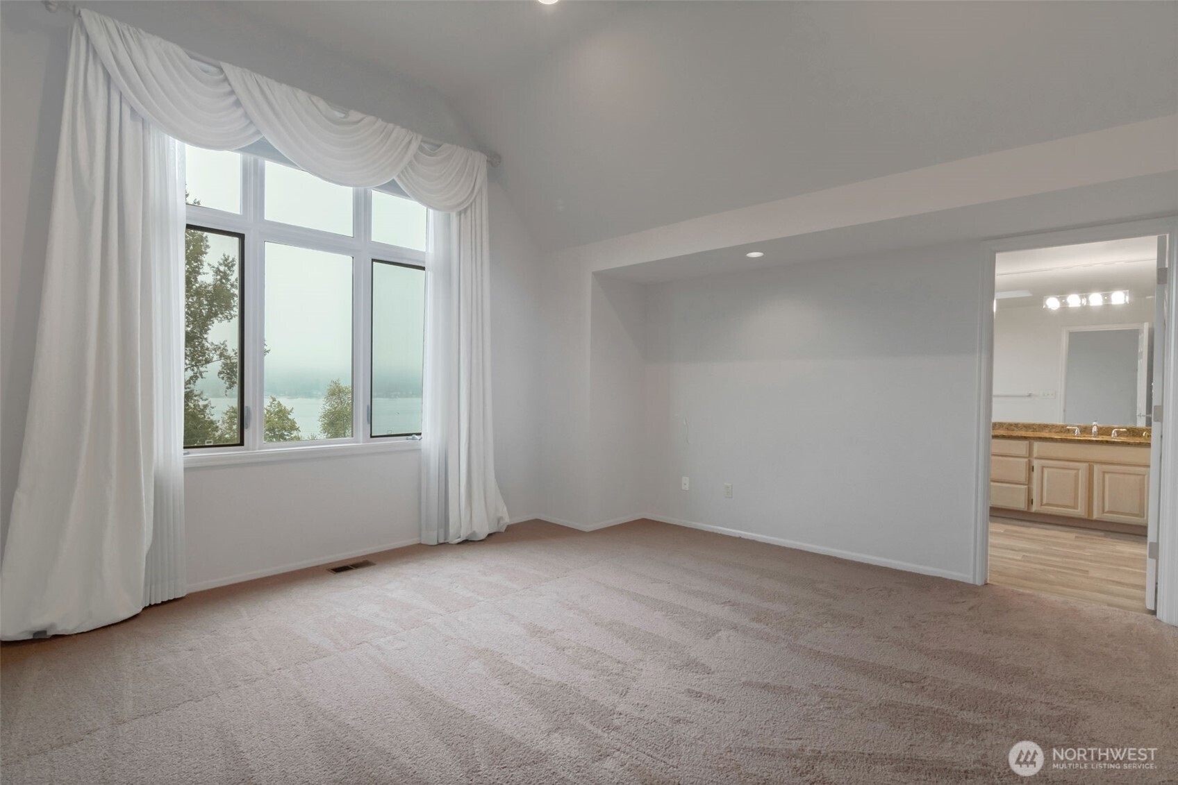 4131 205th Avenue Southeast Sammamish, WA 98075 - Photo 10 of 20 a view of an empty room with a window
