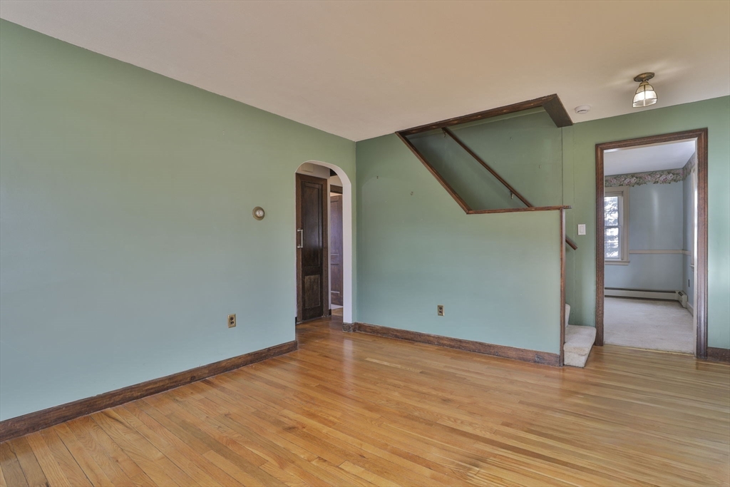 3 Veterans Lane Stoneham, MA 02180 - Photo 14 of 41 an empty room with wooden floor and closet