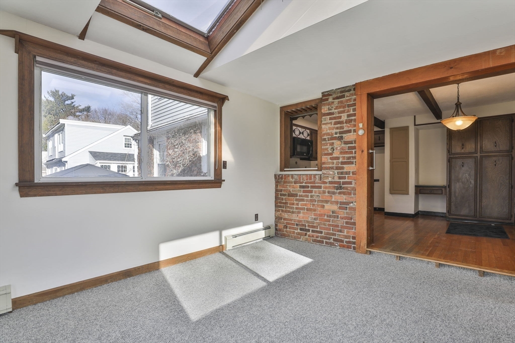 3 Veterans Lane Stoneham, MA 02180 - Photo 10 of 41 a view of an empty room with wooden floor