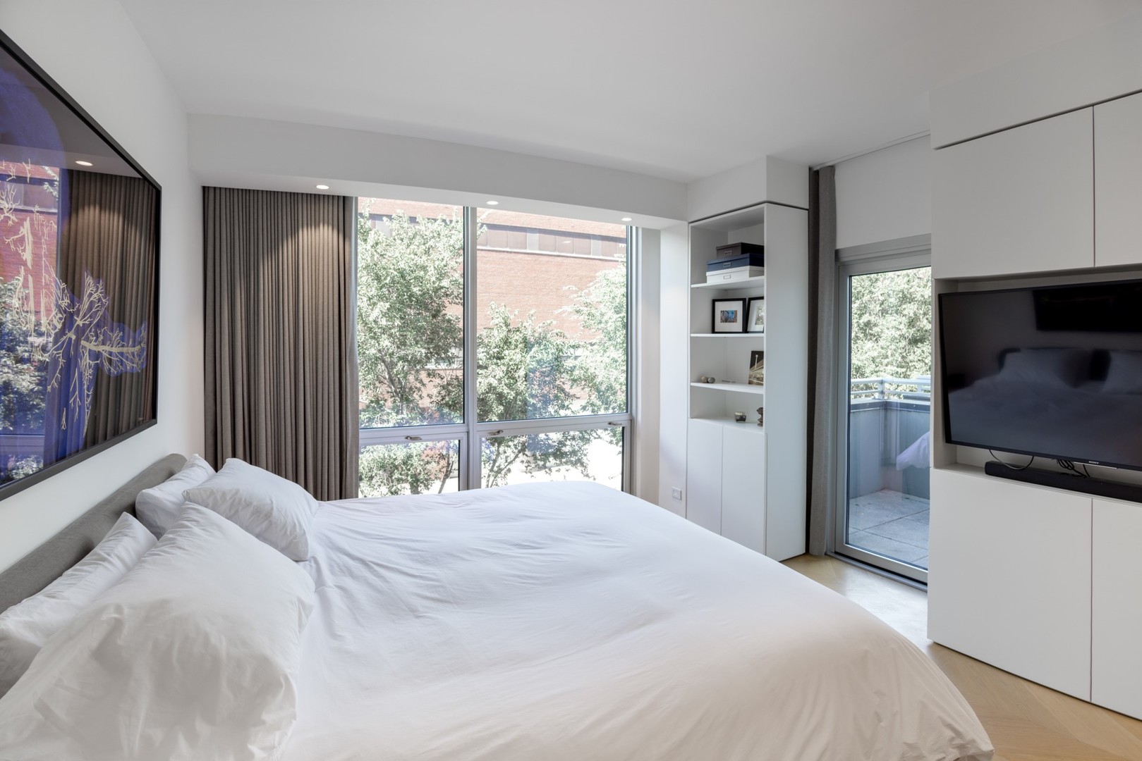 1917 South Calumet Avenue Chicago, IL 60616 - Photo 15 of 41 a bedroom with a bed and a large window