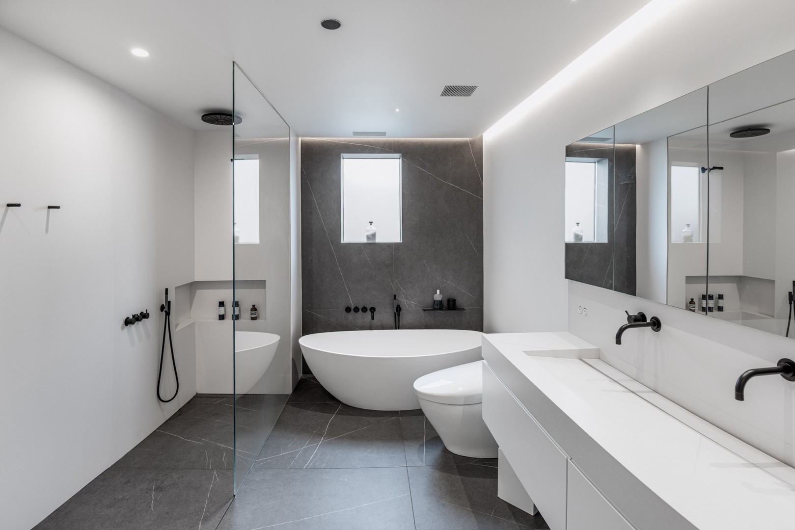 1917 South Calumet Avenue Chicago, IL 60616 - Photo 18 of 41 a bathroom with a double vanity sink a large mirror and a shower