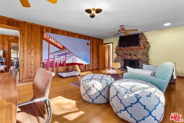 a living room with furniture fireplace and a flat screen tv
