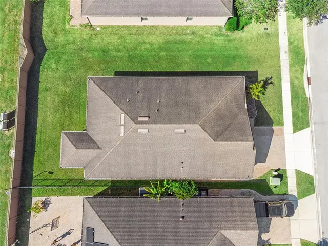 an aerial view of residential house with outdoor space