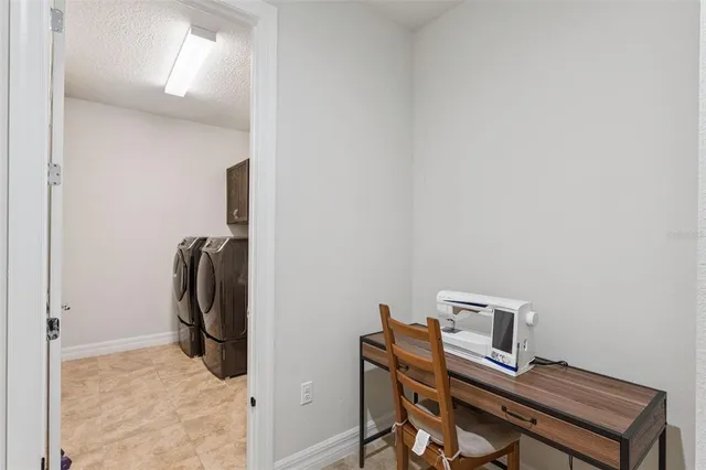 a view of a workspace with furniture